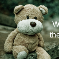 Split image: Young child with medium skin visibly sad, hugging an adult, and a teddy bear sitting on a stone structure all alone. Features text "What to do when there's a Lost Toy"