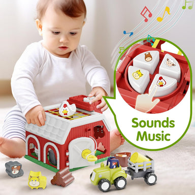 Baby playing with a toy farm set, including a barn and farm animals, with sound and music features.